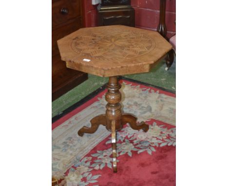 A 19th century Maltese walnut and marquetry octagonal tripod centre table, the top profusely inlaid with a stylised star moti