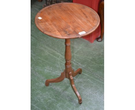 A 19th century solid yew tripod occasional table, circular top with reeded border, turned slender baluster column, shaped dow