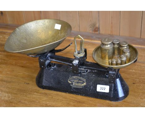 A set of cast iron and brass scales, FJ Thornton; a set of eight weights