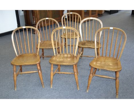 A near set of six 19th ash and elm kitchen dining chairs, hooped stick backs, saddle seats, turned legs and H-stretchers, c.1