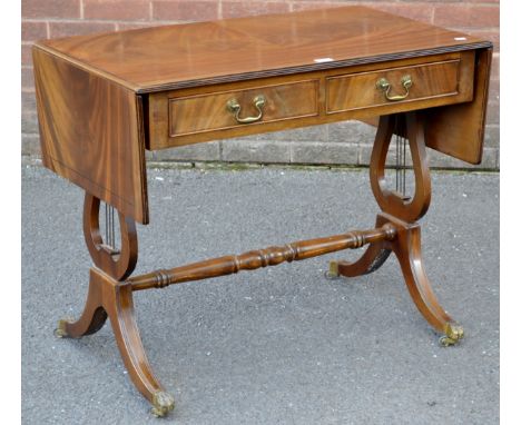 A mahogany sofa table