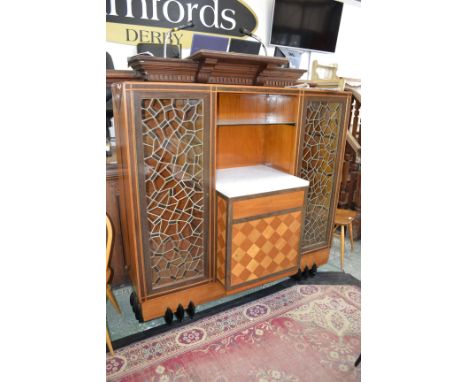 A Continental Art Deco two-tone hardwood side cabinet, flush top above an open niche with glass shelf, marble plateau, drawer