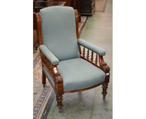 A Victorian mahogany arm chair with scroll arms, turned legs, ceramic casters, c1870