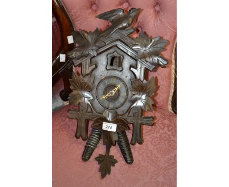 A Bavarian carved cased Cuckoo clock, two train movement