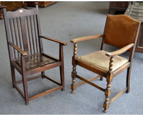 An Arts and Crafts style open arm chair; an oak open arm chair with bobbin supports 