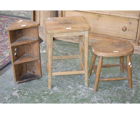 A small 19th century elm stool; an early 20th century elm kitchen stool; a small pine corner shelf unit (3)