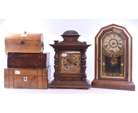 An American type mantel clock, 40 cm high, another mantel clock, a clock garniture, an inlaid box, and two others (8) 