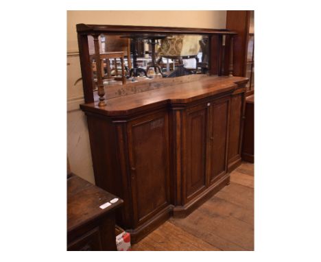 A 19th century rosewood breakfront chiffonier, having a mirrored back above two pairs of panel doors, one door bears a stamp 