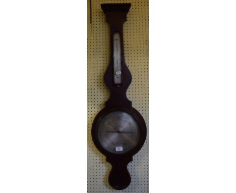 A 19th century barometer, with thermometer, the silvered dial signed Lynch, Dublin, in an inlaid mahogany wheel case, 110 cm 