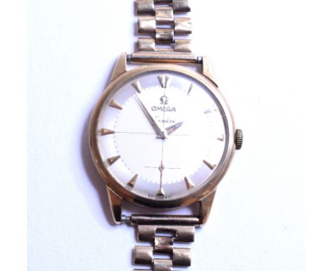 A gentleman's 9ct gold Omega Geneve wristwatch, with baton indices and subsidiary seconds dial, on a 9ct gold bracelet   Cond