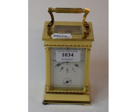 A carriage clock, with alarm, in a brass case, 16 cm high   Condition report  With key, modern, good condition