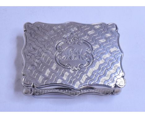 A Victorian silver vinaigrette, initialled, and with engine turned decoration, Nathaniel Mills, Birmingham 1853, 4.5 cm wide 