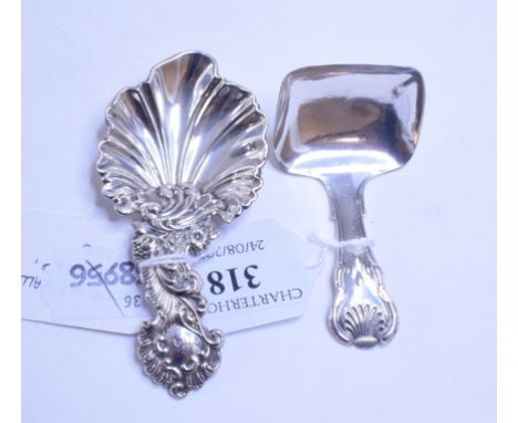 A Victorian silver rococo style caddy spoon, initialled, with a shell type bowl, Martin & Hall, Sheffield 1856, and another s