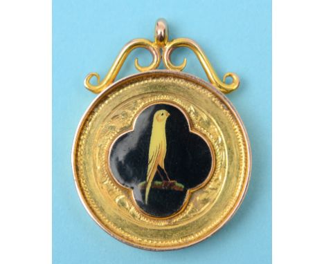 A 9ct gold medallion, applied an enamel plaque decorated a yellow canary, approx. 11.2 g (all in)  See front cover colour ill