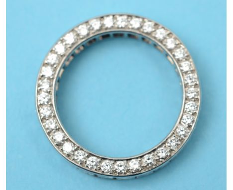 An 18ct white gold and diamond eternity ring, set princess and brilliant cut stones, approx. ring size K½  See front cover co