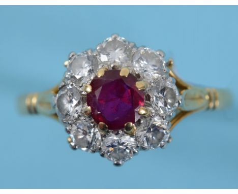 A 18ct gold, platinium, ruby and diamond cluster ring, approx. ring size P  See illustration    Condition report  Report by N