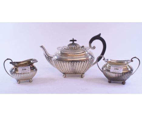 A silver three piece tea service, with a reeded lower body, Sheffield 1932, approx. 23.8 ozt (all in) (3)