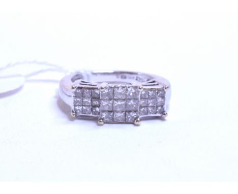 An 18ct white gold diamond ring, set twenty seven princess cut stones, approx. rings size K ½   Condition report  Approx. 6.2