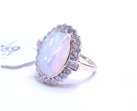 A 9ct gold, large opal and diamond ring, approx. ring size N½   Condition report  Modern, approx. 4.9 g (all in) 