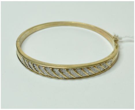 A 9ct gold and diamond bangle   Condition report  Report by NGApprox. 15.5 g (all in)