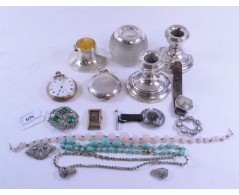 A silver and enamel capstan inkwell, Birmingham 1946, 3.5 cm high, a silver coloured metal mounted glass match striker, a pai