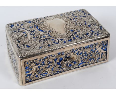 A silver mounted jewellery chest, embossed face masks, birds, cherubs and scrolling foliage, having a pull out drawer, Willia