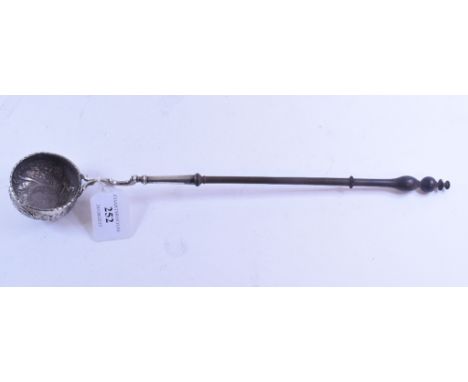 An 18th century toddy ladle, inset a coin and with embossed decoration, on a turned wood handle, 38 cm    Condition report  U