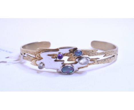 A 9ct white and yellow gold bangle, set opals, moonstones and an amethyst, approx. 23.8 g (all in)