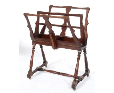 A 19th century mahogany folio stand, on turned legs, joined by turned stretchers, 84 cm wide  See illustration  Provenance:  