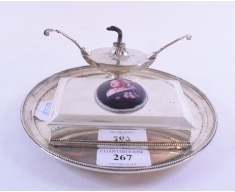 A silver table top cigarette box and lighter set, London 1885, later applied a plaque decorated Queen Victoria, 17 cm diamete