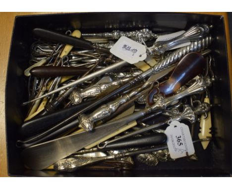An Edwardian silver button hook and matching shoe horn, Sheffield 1901, a collection of silver and other button hooks, and si