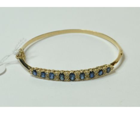 A 9ct gold, sapphire and diamond bangle   Condition report  Report by NGApprox. 10.0 g (all in)