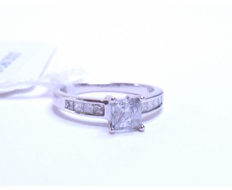 An 18ct white gold and diamond ring, set princess cut stones, approx. ring size K½   Condition report  Approx. 3.3 g (all in)