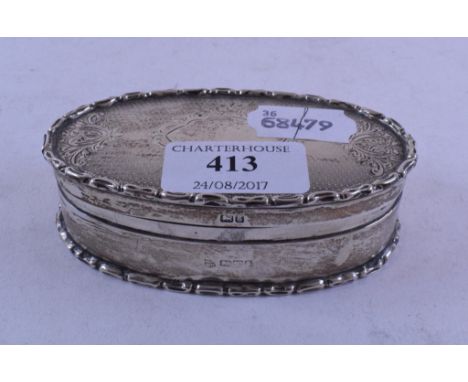 A silver oval box and hinged cover, with engine turned decoration, Chester 1905, approx. 3.8 ozt