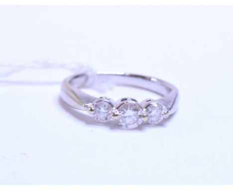 An 18ct white gold and three stone diamond ring, approx. ring size K   Condition report  Approx. 3.1 g (all in) center stone 