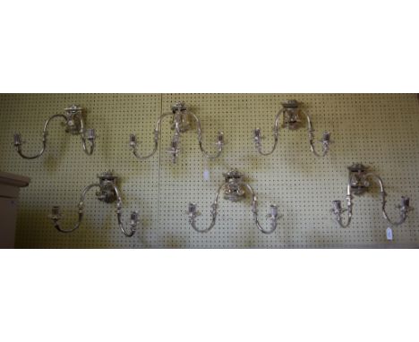 A matched set of modern plated wall sconces, varying sizes, one three light and four two light (5)