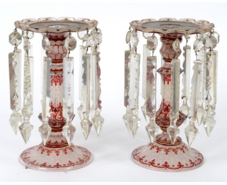 A pair of 19th century Bohemian flashed ruby glass lustres, with gilt detailing and etched floral and foliate decoration, one