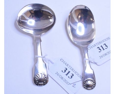 An early 19th century silver fiddle and shell pattern caddy spoon, Thomas Wallis & Jonathan Hayne, London 1816, and another s