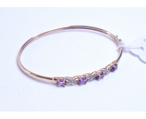 A 9ct gold, amethyst and diamond bangle, and two others similar (3)