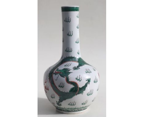 A Chinese famille verte bottle vase decorated with dragons chasing a flaming pearl, blue character mark to base, 34cms high.