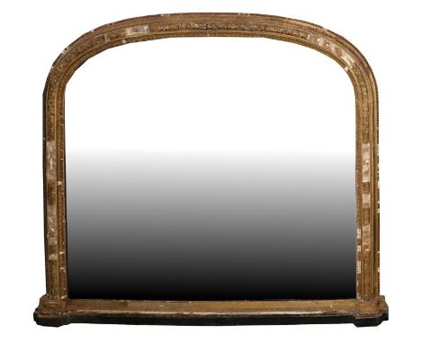 A large Victorian arch topped giltwood and gesso overmantle mirror with original ceramic bun feet and mirror plate, 178cms wi