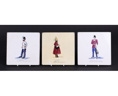 A set of three ceramic tiles depicting military figures, The 52nd Light Infantry Bandsman, The 4th Dragoon Guards  and the 48