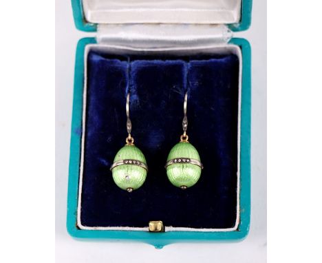 A pair of Russian Carl Faberge style green enamel and diamond orb form drop earrings, cased.