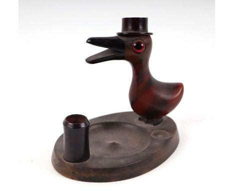 A novelty ashtray in the form of a bird wearing a hat with what looks to be a cherry amber Bakelite beak,  12cms highConditio