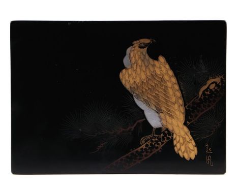 A Japanese black lacquered panel decorated with a bird of prey perched on a branch, signed lower right, 21 by 15cms.