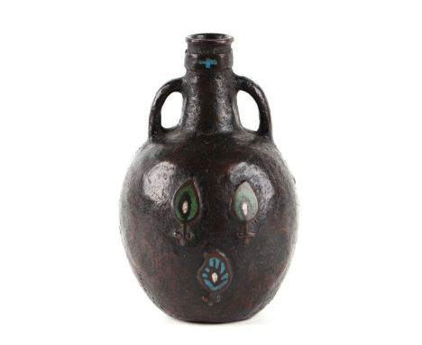 A bronze and champlevé enamel holy water flask, possibly Limoges, 12cms high.Condition ReportGood condition with no damage or