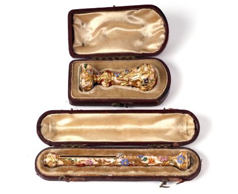 A 19th century continental yellow metal enamel and hardstone desk seal modelled in the rococo style in high relief, the hards