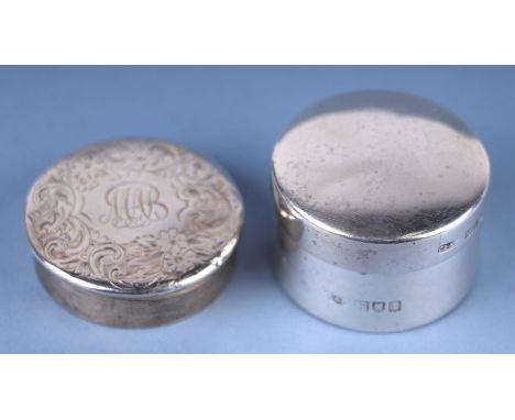 An Edwardian silver miniature pill box and cover, Asprey, London 1906, 29g, 3.5cms diameter; together with another sterling s