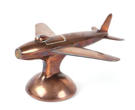 A Dunhill copper table lighter in the form of a jet aeroplane, design no. 872899, 16cms long (would have originally been silv