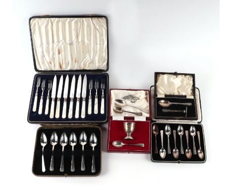 A cased set of eight silver teaspoons; together with two boxed silver christening sets; a Mappin &amp; Webb cased set of dess